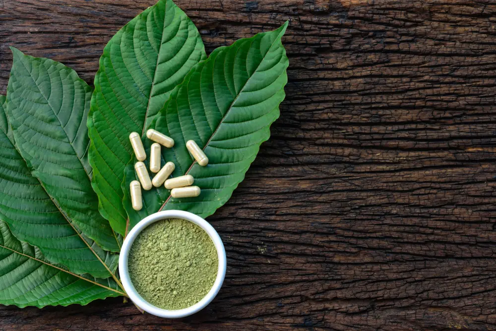 Kratom capsules and leaves